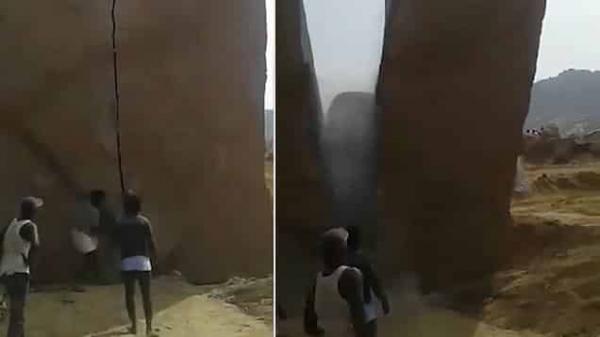 بطريقة لا تصدق... رجال يفلقون صخرة هائلة (فيديو)