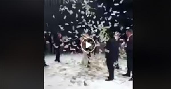 الأموال تمطر عروسين خلال رقصهما (فيديو)
