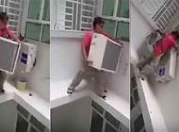 بالفيديو: أخطر عملية تركيب لجهاز تكييف على حافة مبنى