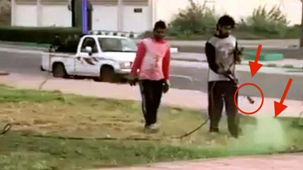 فضيحة : عمال بلدية يرشون الحدائق الميتة بدهان أخضر لتمويه موكب أمير سعودي ( الفيديو )