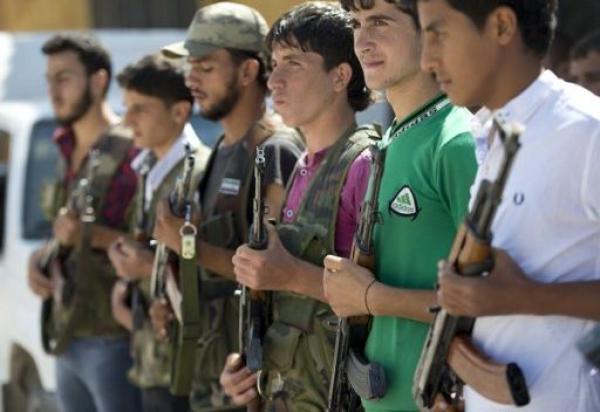 "الغارديان": مئات المقاتلين الاجانب يتوافدون الى سورية لمحاربة النظام