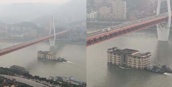 بالفيديو..  مبنى ضخم يعبر نهرا ويثير دهشة السكّان