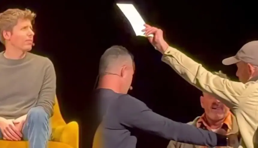 رجل يقتحم منصة ندوة ليسلّم مذكرة قضائية لـ سام ألتمان وسط ذهول الحضور