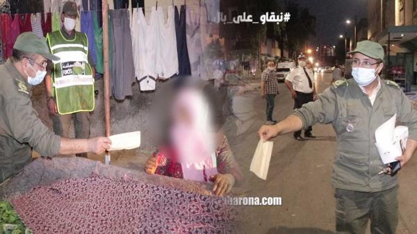 السلطات المحلية تقوم بحملات واسعة بأحد الأحياء الشعبية وتوزع الكمامات على المواطنين