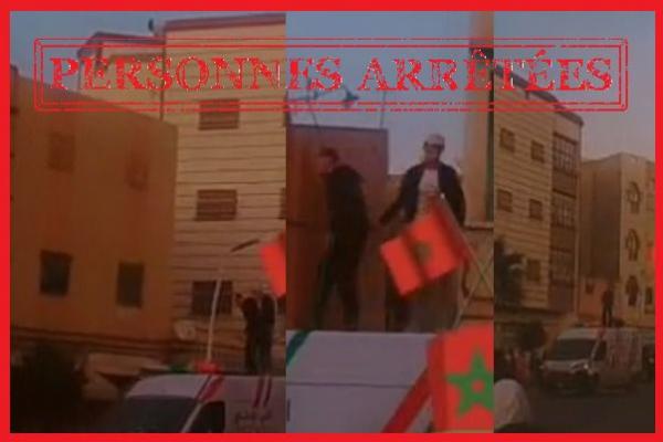 شخصان يعتليان سطح سيارة للشرطة والأمن يتدخل