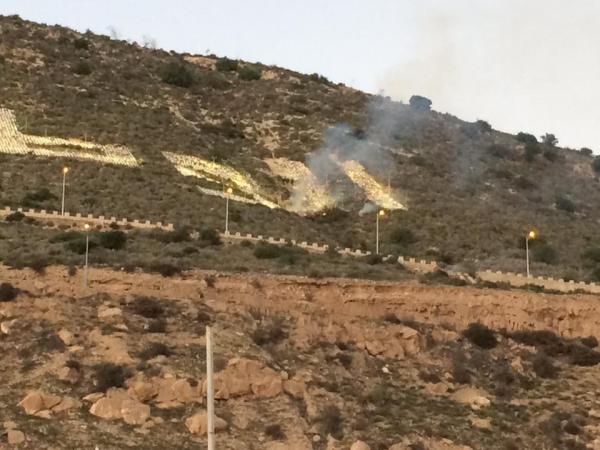 احتراق كلمة "الوطن" في الشعار الشهير بأكادير