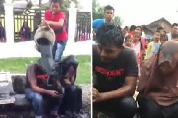 بالفيديو: لماذا عاقب قرويون شاباً وفتاة بصب مياه المجاري عليهما؟