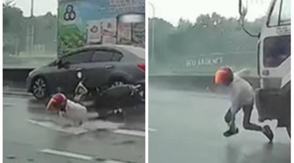 لحظة نجاة سائق  دراجة نارية في اللحظة الأخيرة قبل أن تدهسه شاحنة(فيديو)