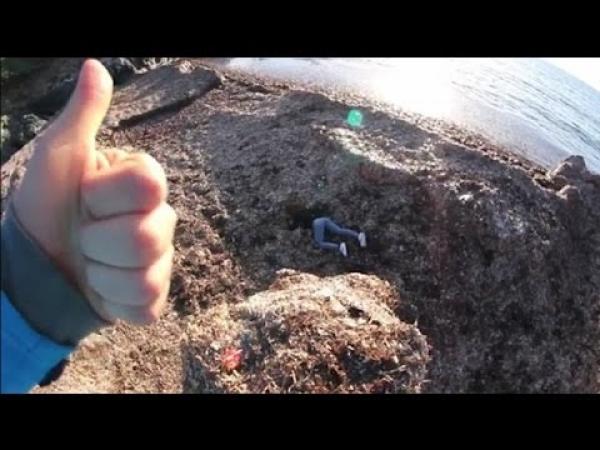 بالفيديو: شاب يدفع حبيبته من فوق جرف صخري