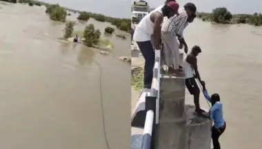 بالفيديو..  امرأة تدفع زوجها في النهر خلال التقاط صورة
