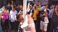 تشيلي:  تعرية لص وربطه بعامود إنارة لمحاولته سلب عجوز