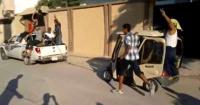 ثوار ليبيا يستولون على توك توك القذافى ويطوفون به 