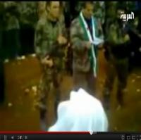 ضابط يؤدي الولاء للأسد أثناء إعلان انشقاقه