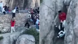 مشهد خطير.. سائحان ينجوان بأعجوبة من السقوط على حافة جبل في الصين