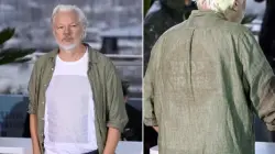 مؤسس موقع ويكيليكس يُلفت الأنظار في مهرجان كان بقميص يحمل أسماء آلاف الأطفال الفلسطينيين