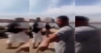 رجل يمسك "دبوز" و يطارد شبابا في أوضاع مخلة للآداب بشواطئ الجزائر